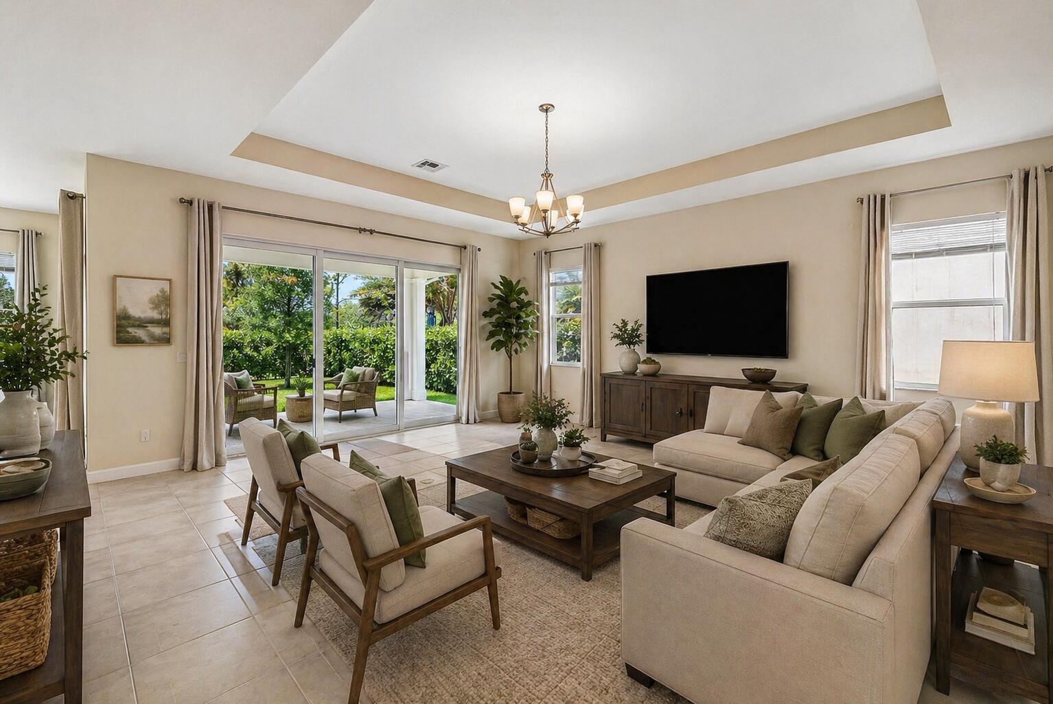 1031 Ember Ridge Run Loxahatchee, FL 33470 - Photo 6 of 52 a living room with furniture a flat screen tv and a large window