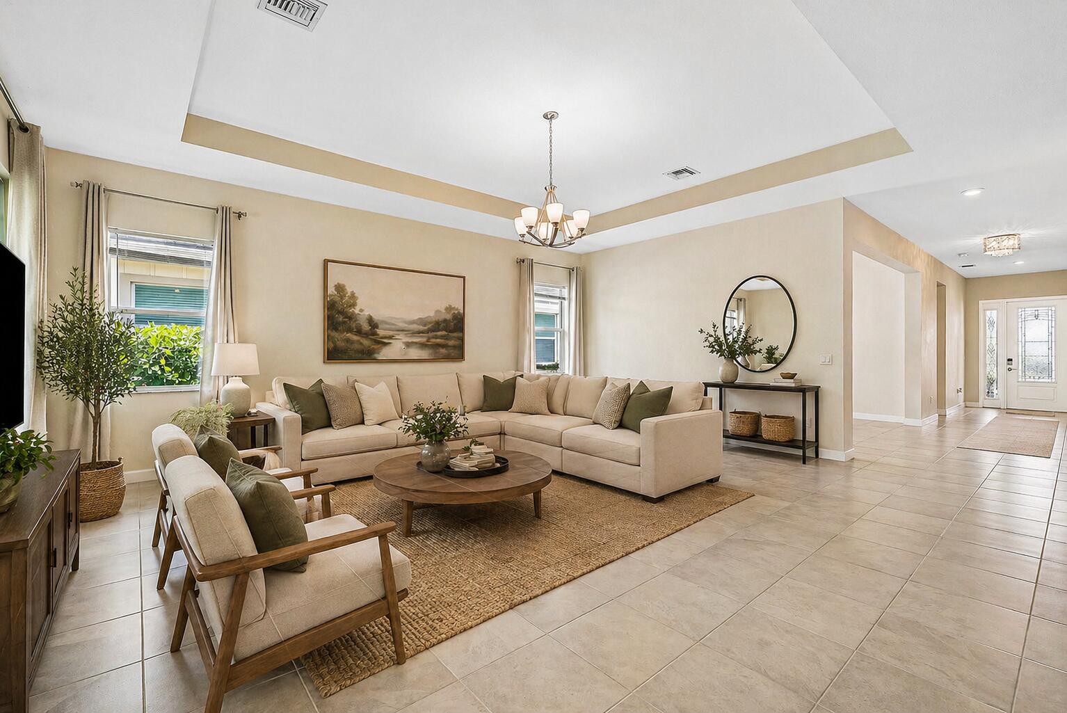1031 Ember Ridge Run Loxahatchee, FL 33470 - Photo 8 of 52 a living room with furniture and a chandelier