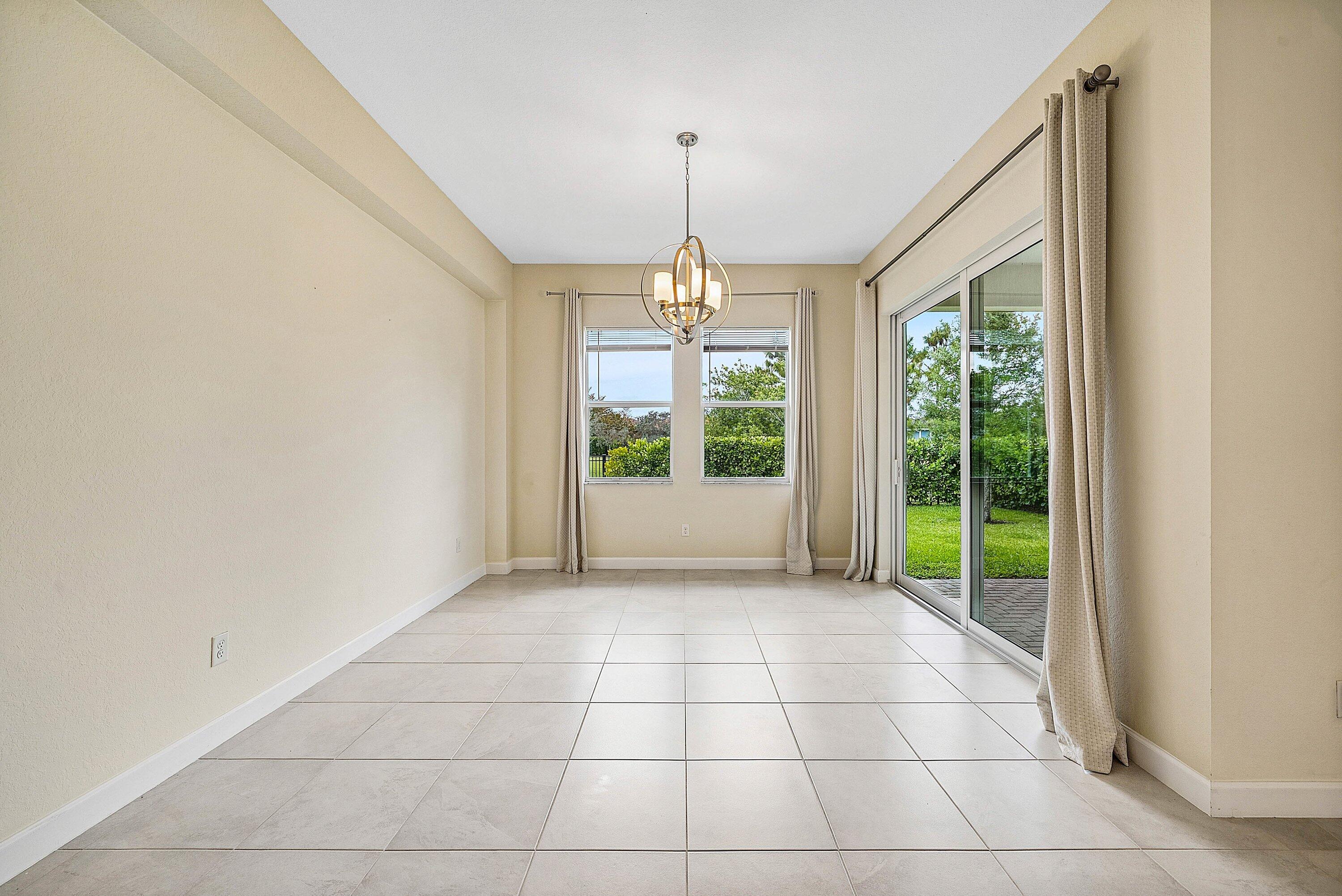 1031 Ember Ridge Run Loxahatchee, FL 33470 - Photo 10 of 52 a view of an empty room with a window
