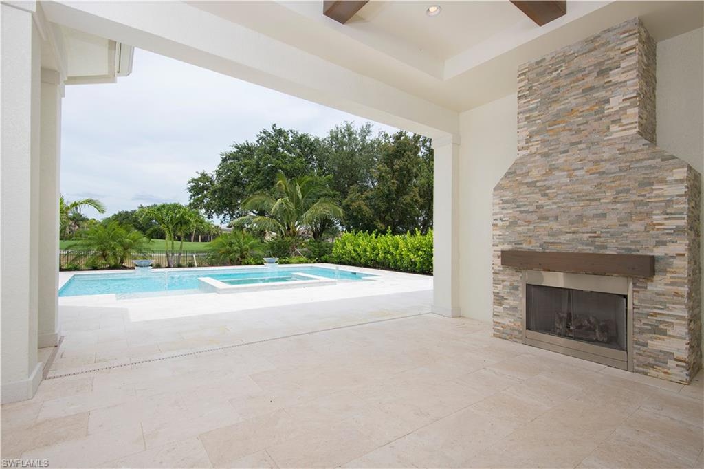 28891 Somers Drive Naples, FL 34119 - Photo 12 of 15 a view of a room that has a fireplace