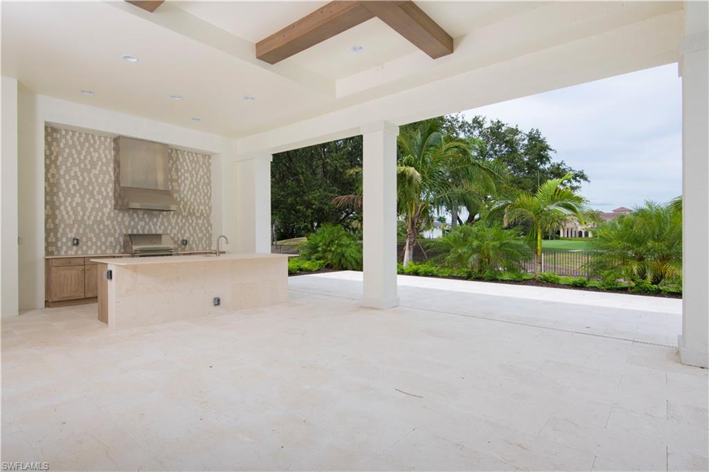 28891 Somers Drive Naples, FL 34119 - Photo 13 of 15 a view of an empty room with a window and kitchen view