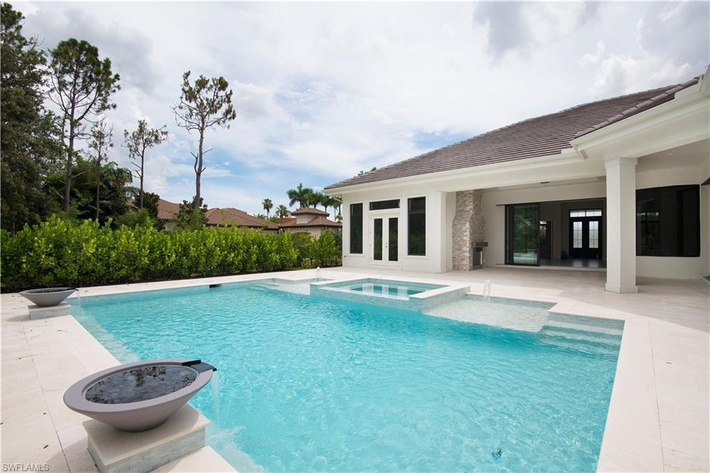 28891 Somers Drive Naples, FL 34119 - Photo 14 of 15 a view of a backyard with a garden and plants