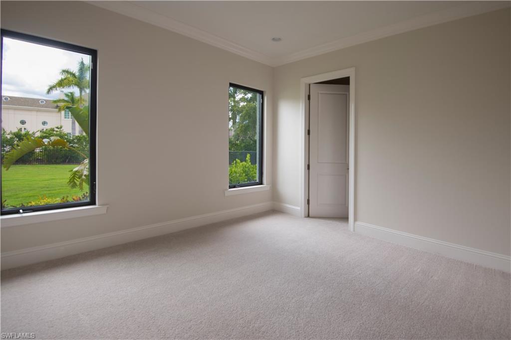 28891 Somers Drive Naples, FL 34119 - Photo 6 of 15 an empty room with windows and view