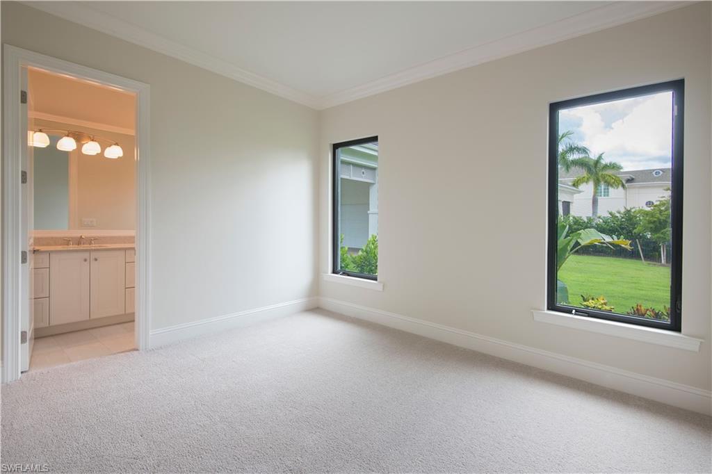 28891 Somers Drive Naples, FL 34119 - Photo 9 of 15 an empty room with windows and closet