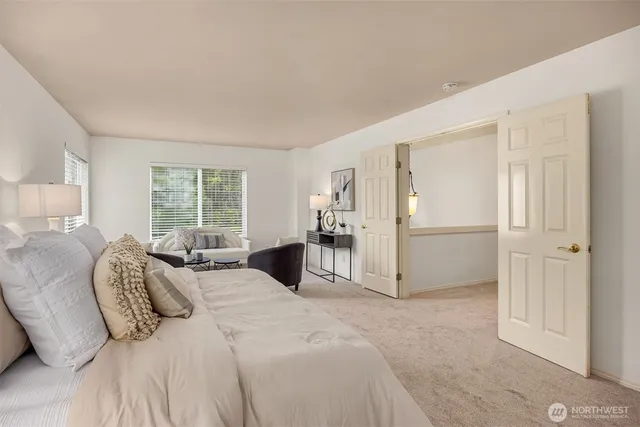 a large white bed in a white room