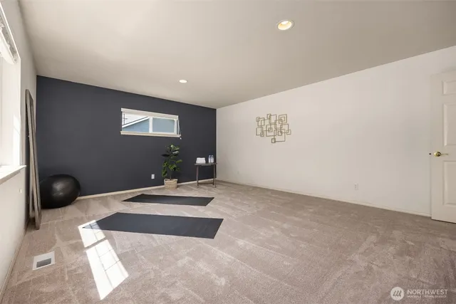 a bedroom with a bed and a view of bathroom