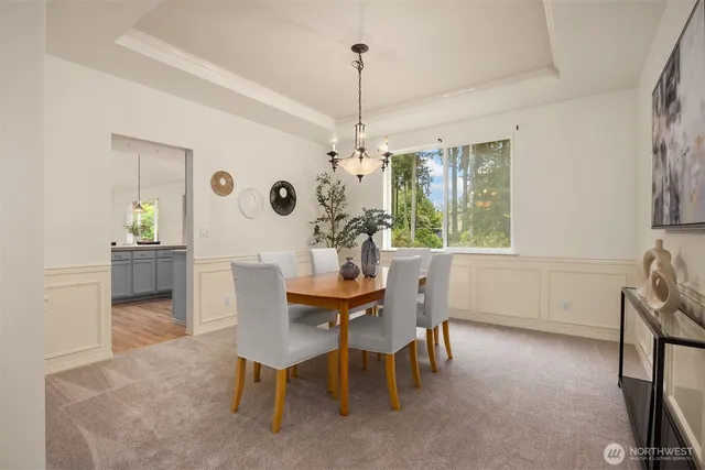 a dining room with furniture and window