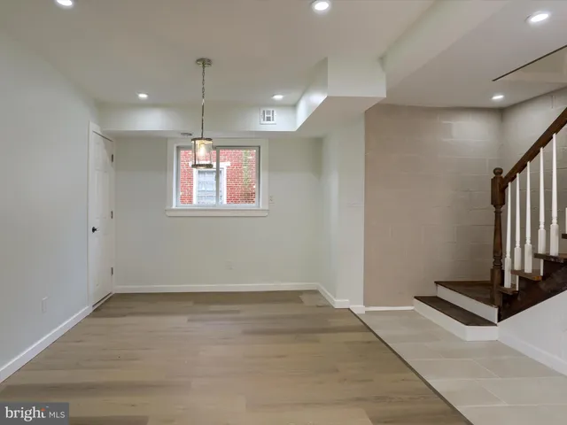 a large kitchen with stainless steel appliances kitchen island a large counter space a sink and appliances