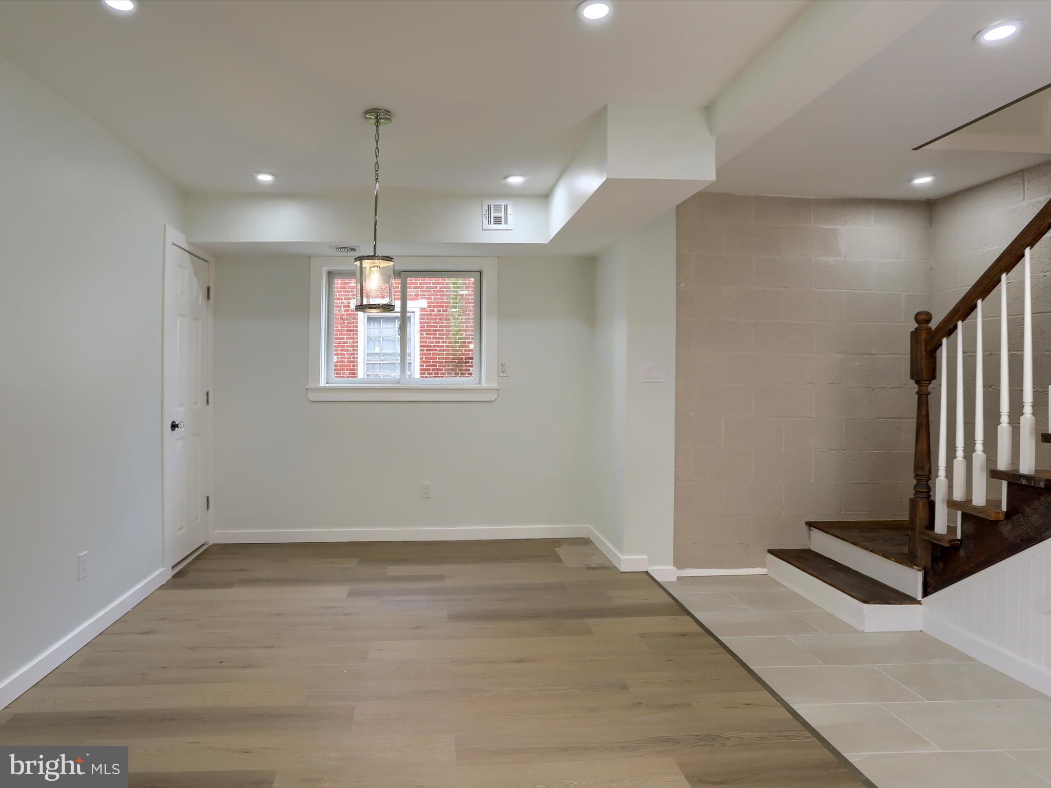 9963 Jonestown Road Grantville, PA 17028 - Photo 11 of 41 a view of an empty room with wooden floor and a window