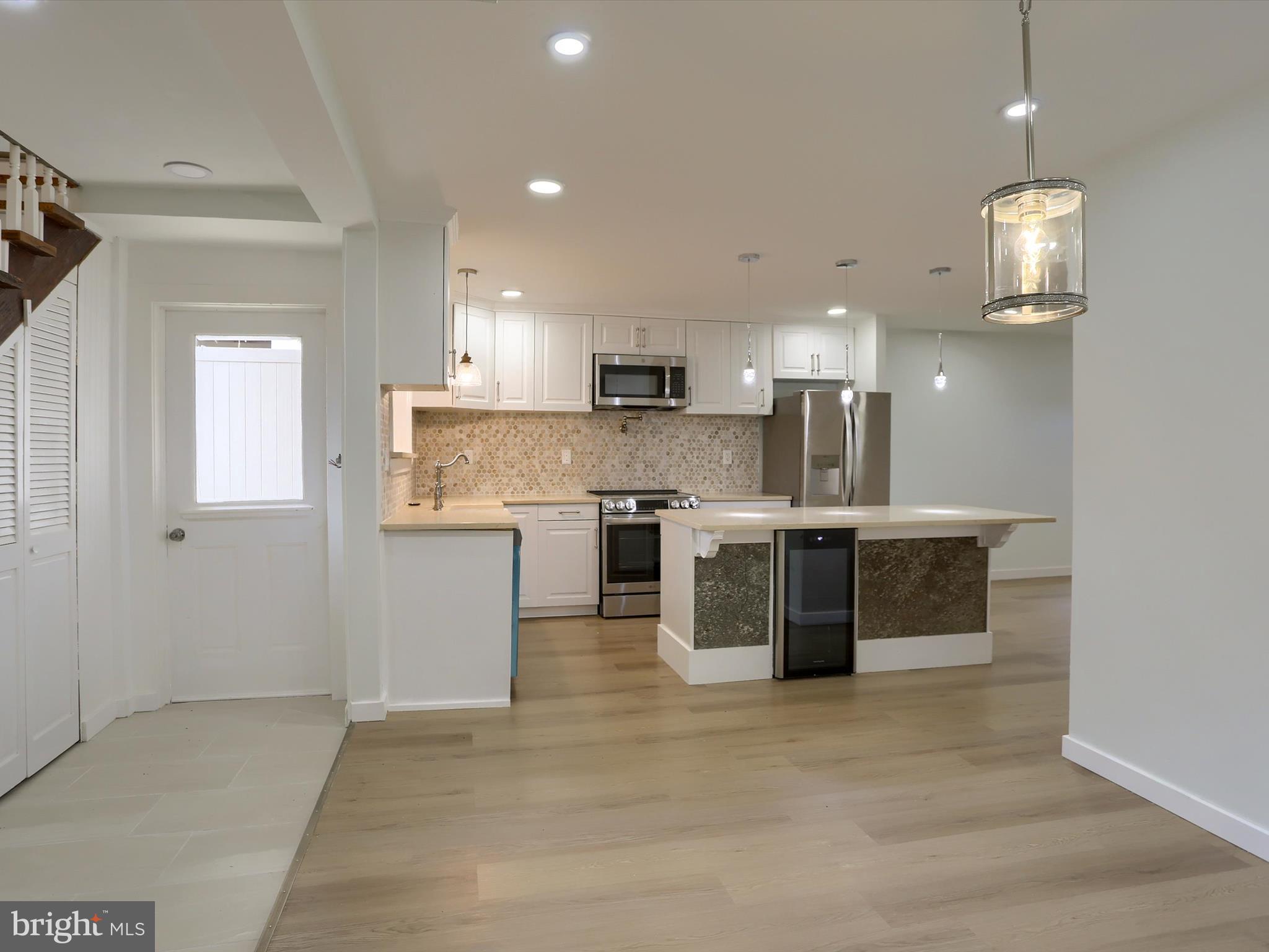 9963 Jonestown Road Grantville, PA 17028 - Photo 12 of 41 a large kitchen with stainless steel appliances kitchen island a large counter space a sink and appliances