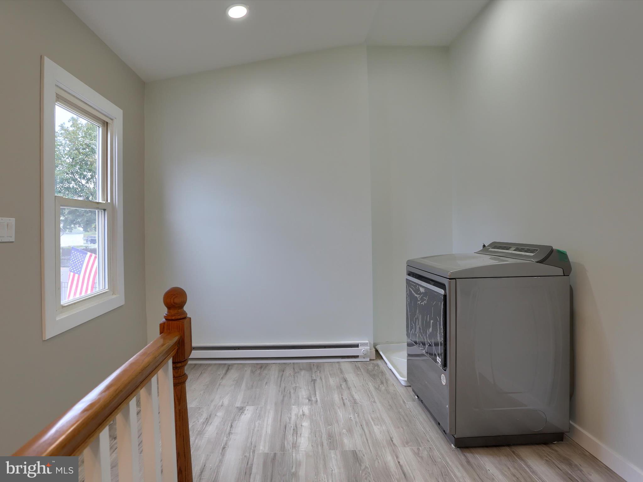 9963 Jonestown Road Grantville, PA 17028 - Photo 13 of 41 a utility room with wooden floor washer and dryer