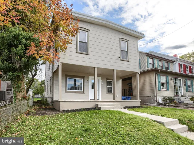 front view of a house with a yard