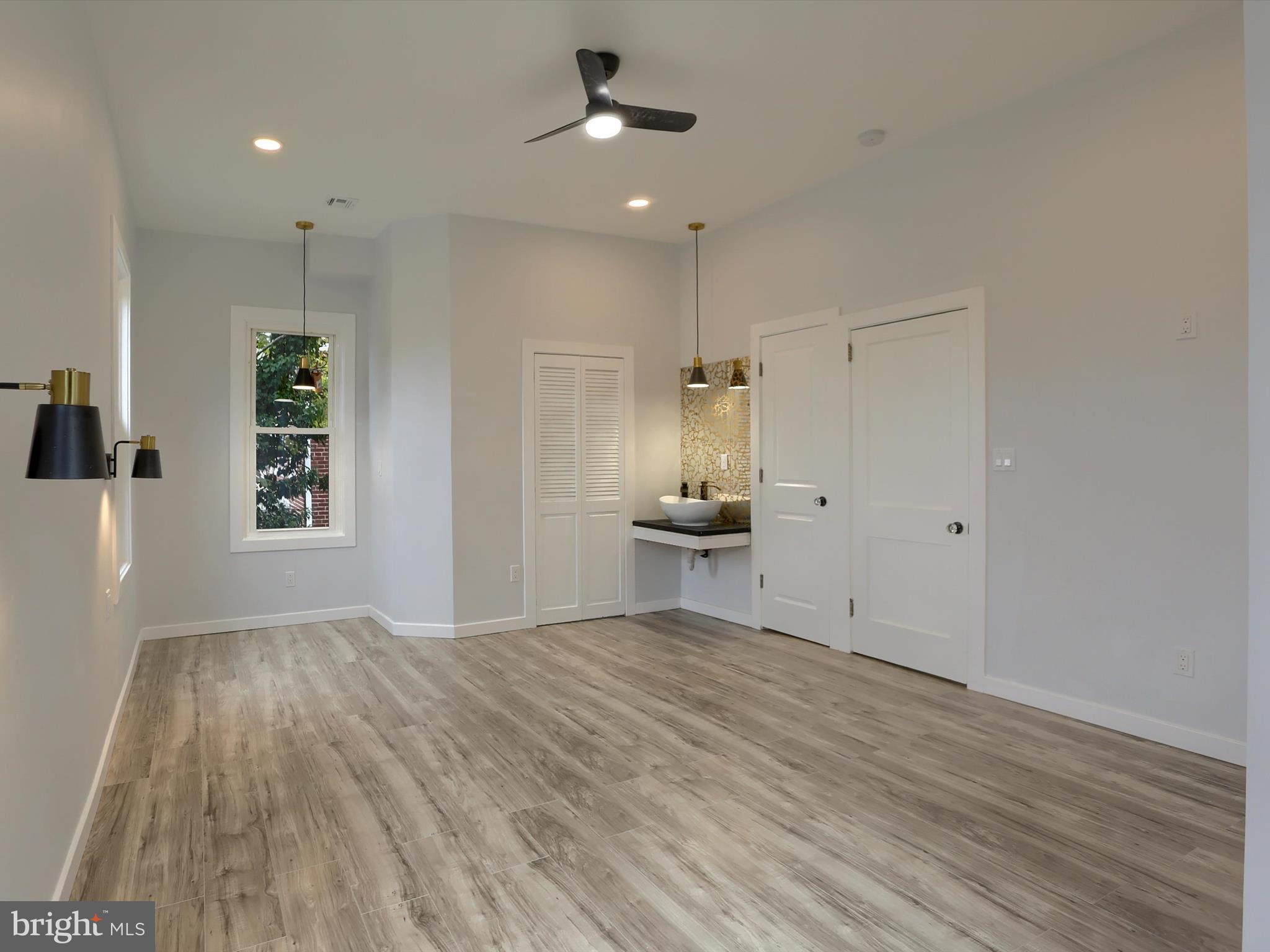 9963 Jonestown Road Grantville, PA 17028 - Photo 23 of 41 a view of empty room with wooden floor and fan