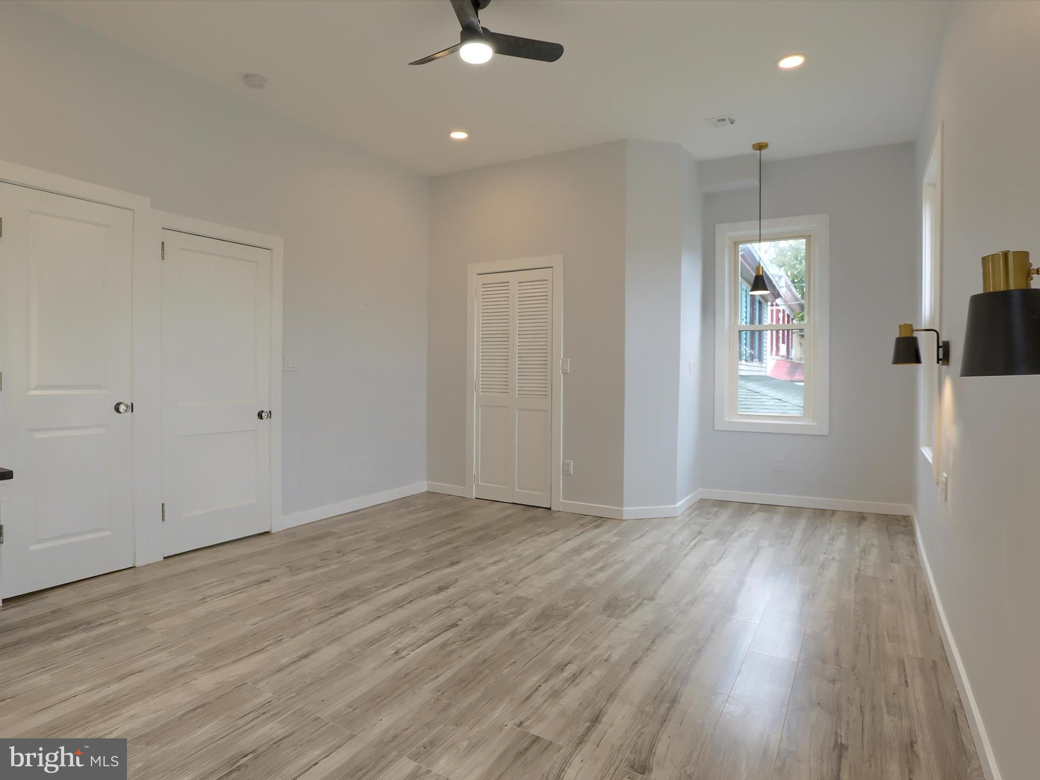 9963 Jonestown Road Grantville, PA 17028 - Photo 24 of 41 an empty room with wooden floor and windows