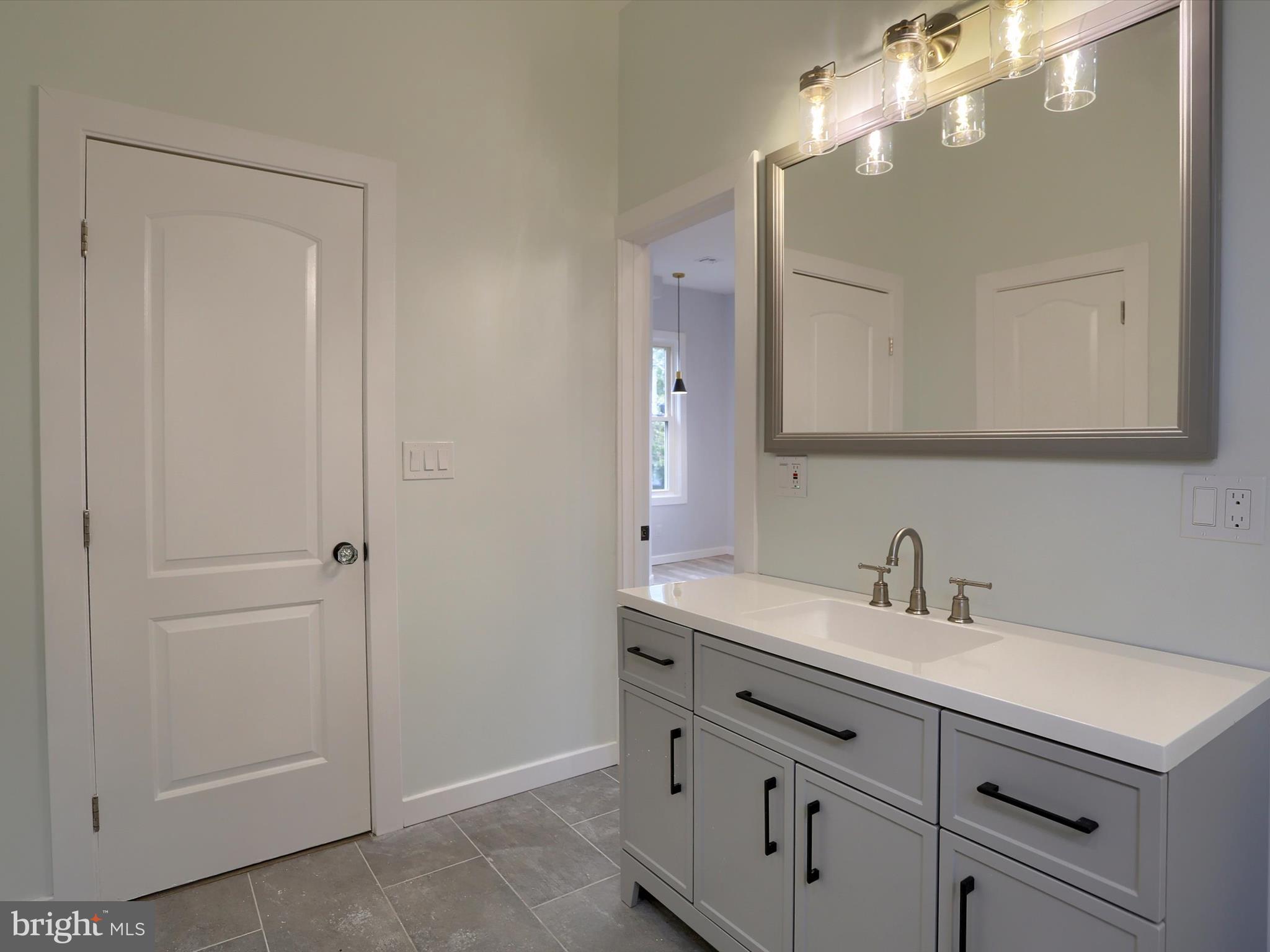 9963 Jonestown Road Grantville, PA 17028 - Photo 29 of 41 a bathroom with a sink vanity and mirror