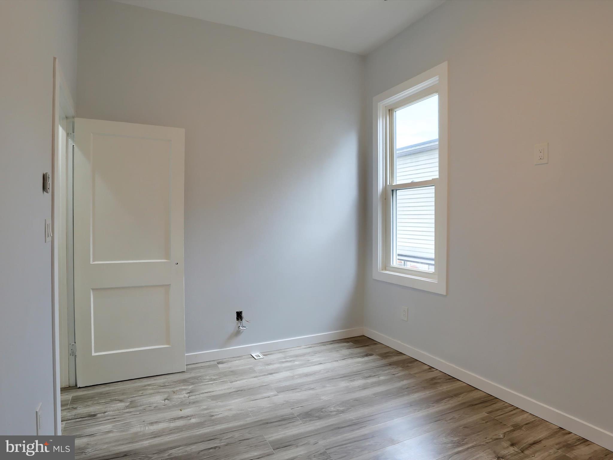 9963 Jonestown Road Grantville, PA 17028 - Photo 33 of 41 an empty room with wooden floor and windows
