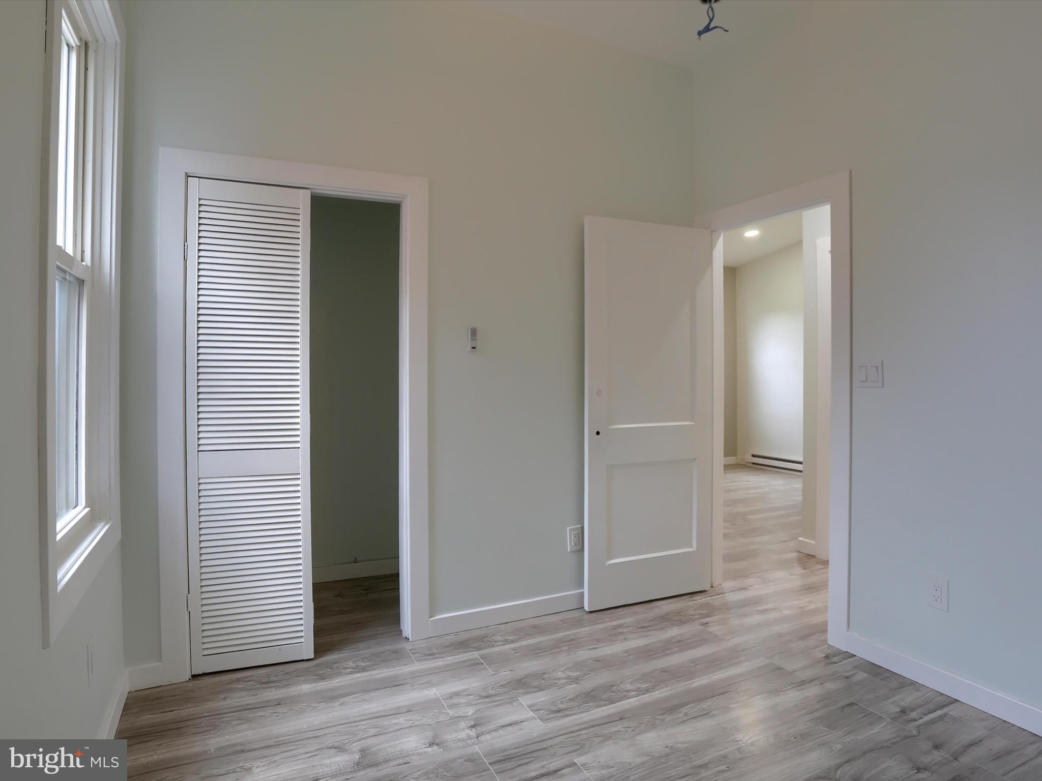 9963 Jonestown Road Grantville, PA 17028 - Photo 35 of 41 an empty room with wooden floor and closet