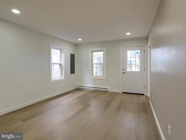 a kitchen with stainless steel appliances granite countertop a refrigerator a stove a sink and a refrigerator