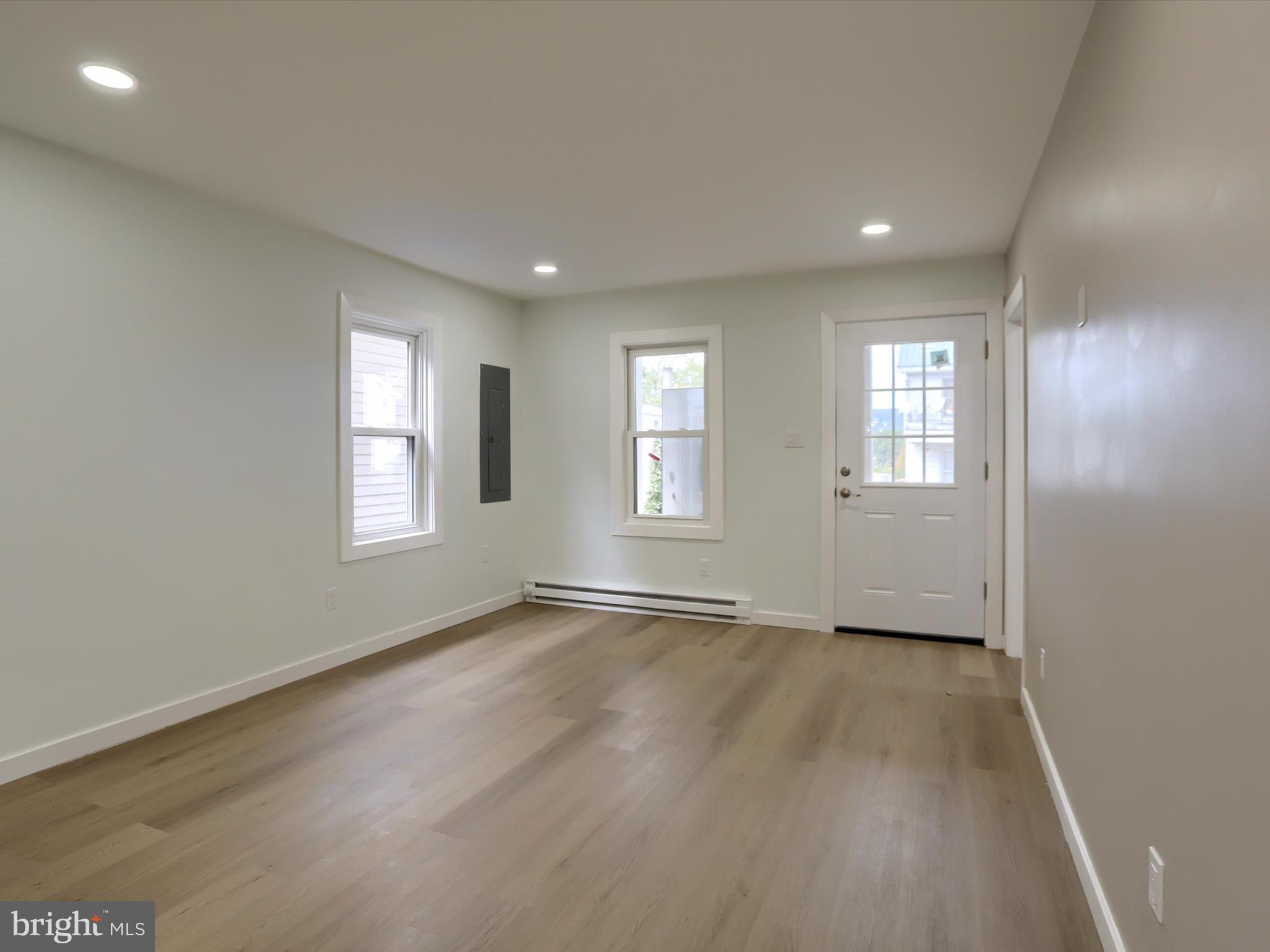 9963 Jonestown Road Grantville, PA 17028 - Photo 5 of 41 an empty room with wooden floor and windows