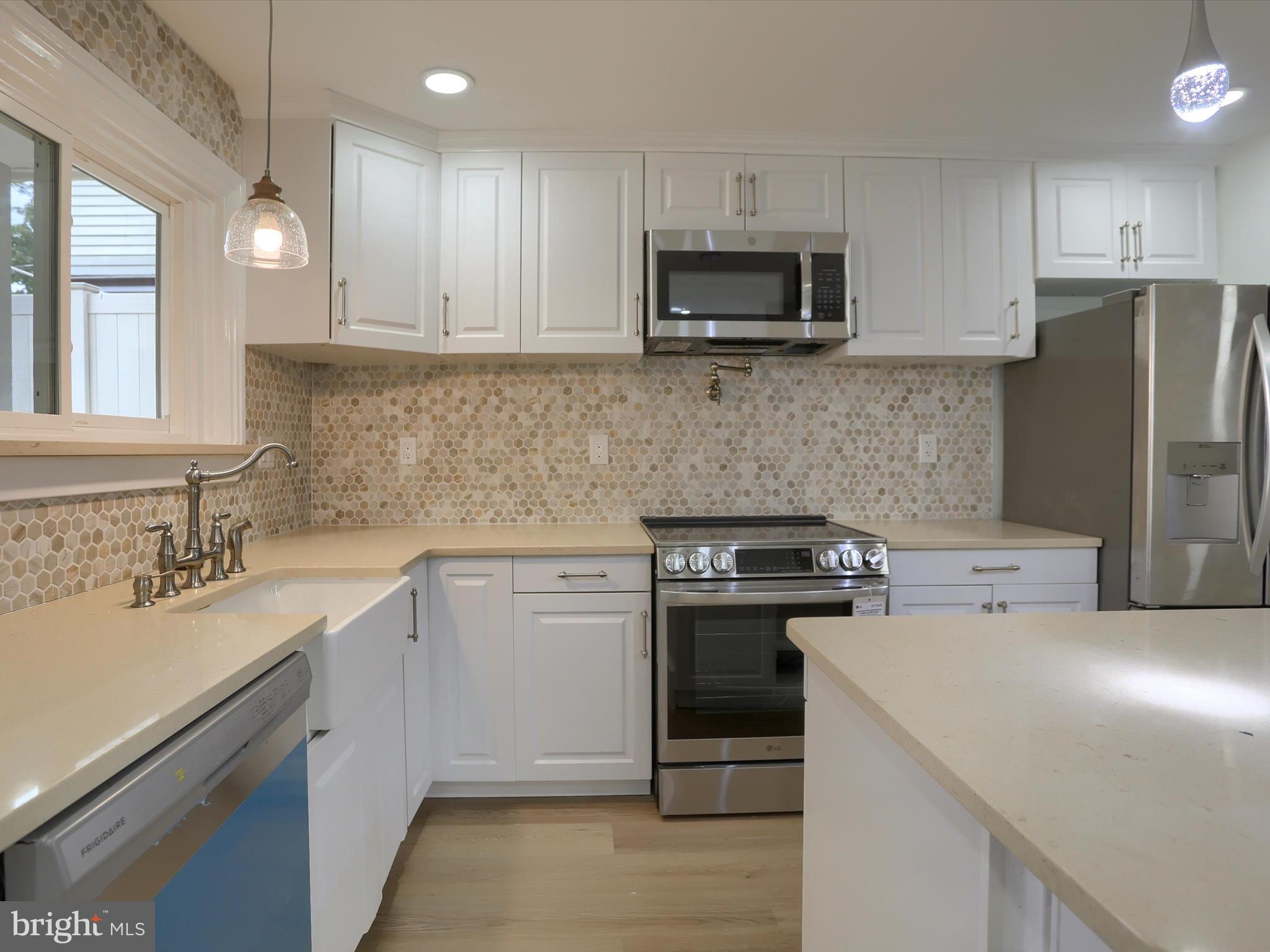 9963 Jonestown Road Grantville, PA 17028 - Photo 9 of 41 a kitchen with a sink stove and refrigerator