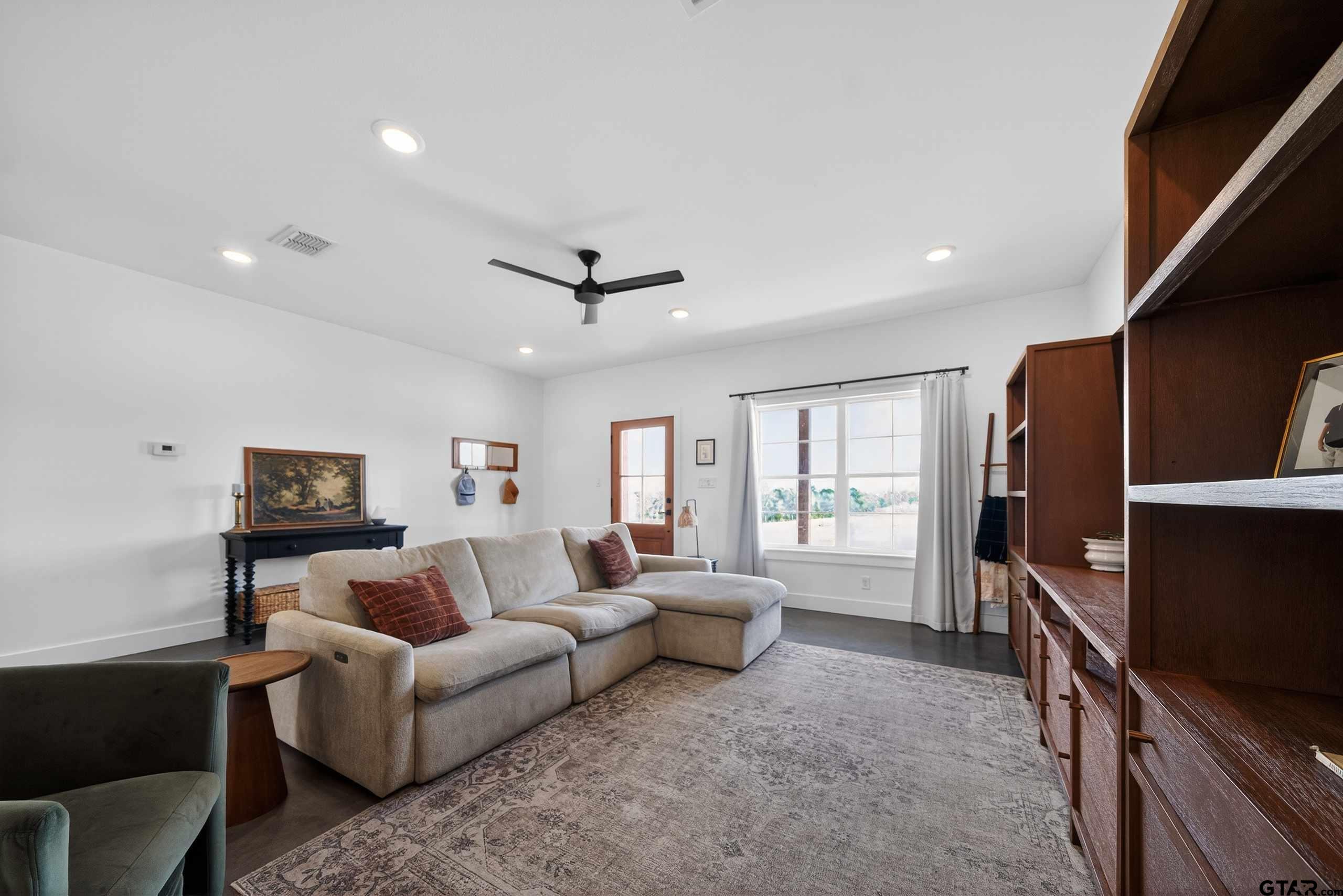 305 Gallatin Cut-Off Road Jacksonville, TX 75766 - Photo 15 of 46 a living room with furniture and a flat screen tv