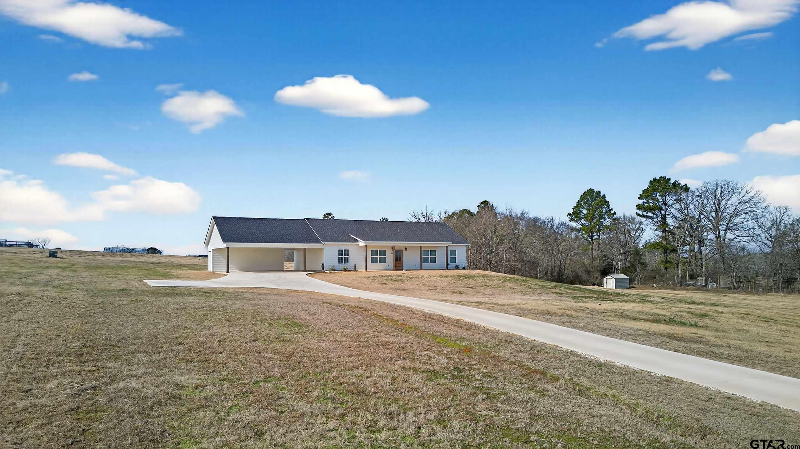 305 Gallatin Cut-Off Road Jacksonville, TX 75766 - Photo 2 of 46 a view of a house and a yard