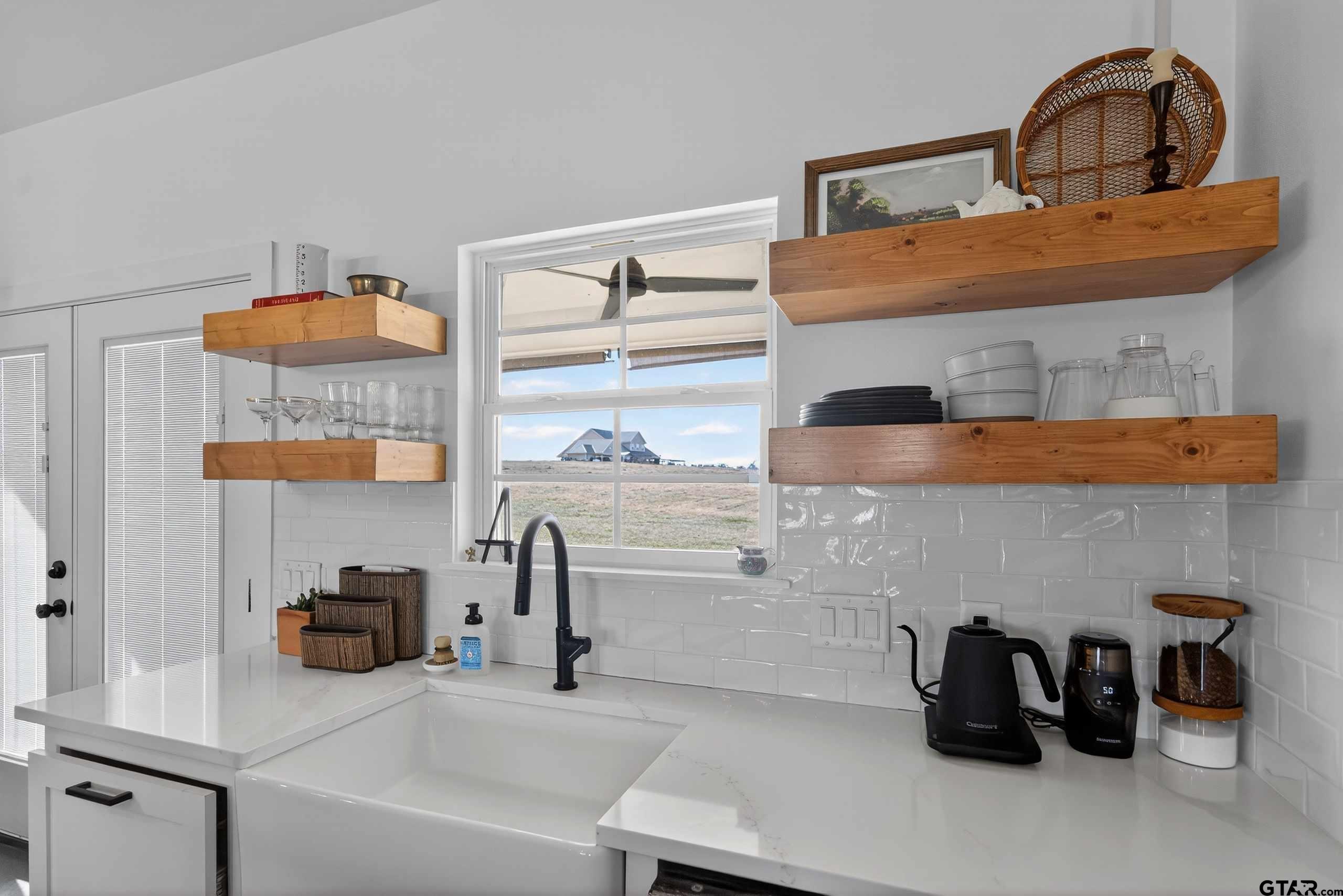 305 Gallatin Cut-Off Road Jacksonville, TX 75766 - Photo 23 of 46 a kitchen with a sink and a stove
