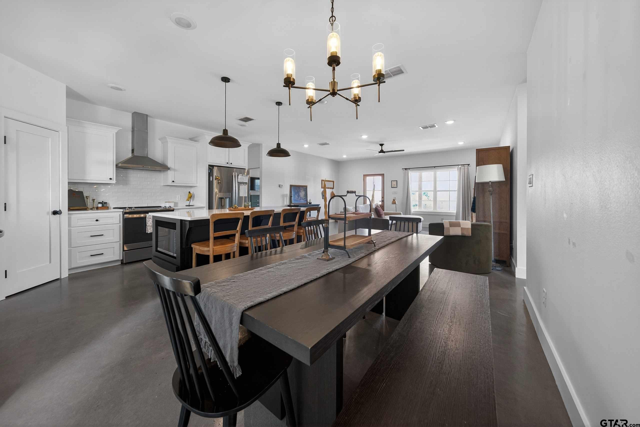 305 Gallatin Cut-Off Road Jacksonville, TX 75766 - Photo 25 of 46 a large kitchen with a table and chairs