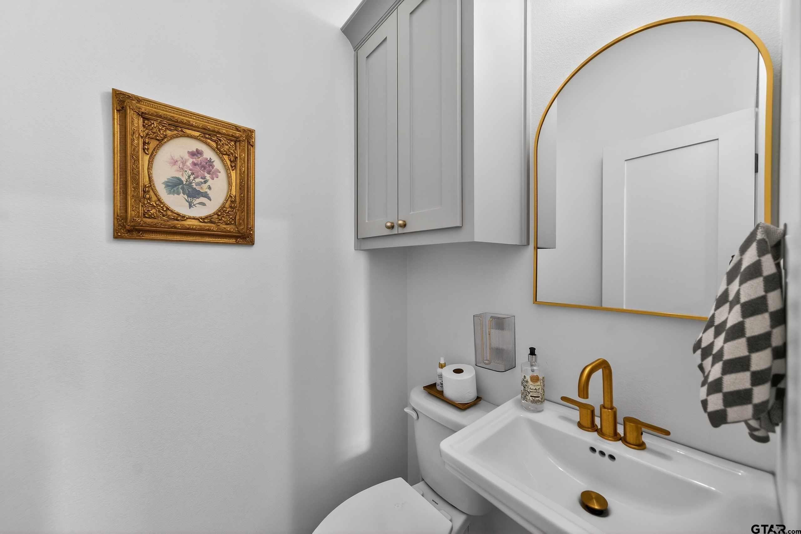 305 Gallatin Cut-Off Road Jacksonville, TX 75766 - Photo 30 of 46 a bathroom with a sink and a mirror