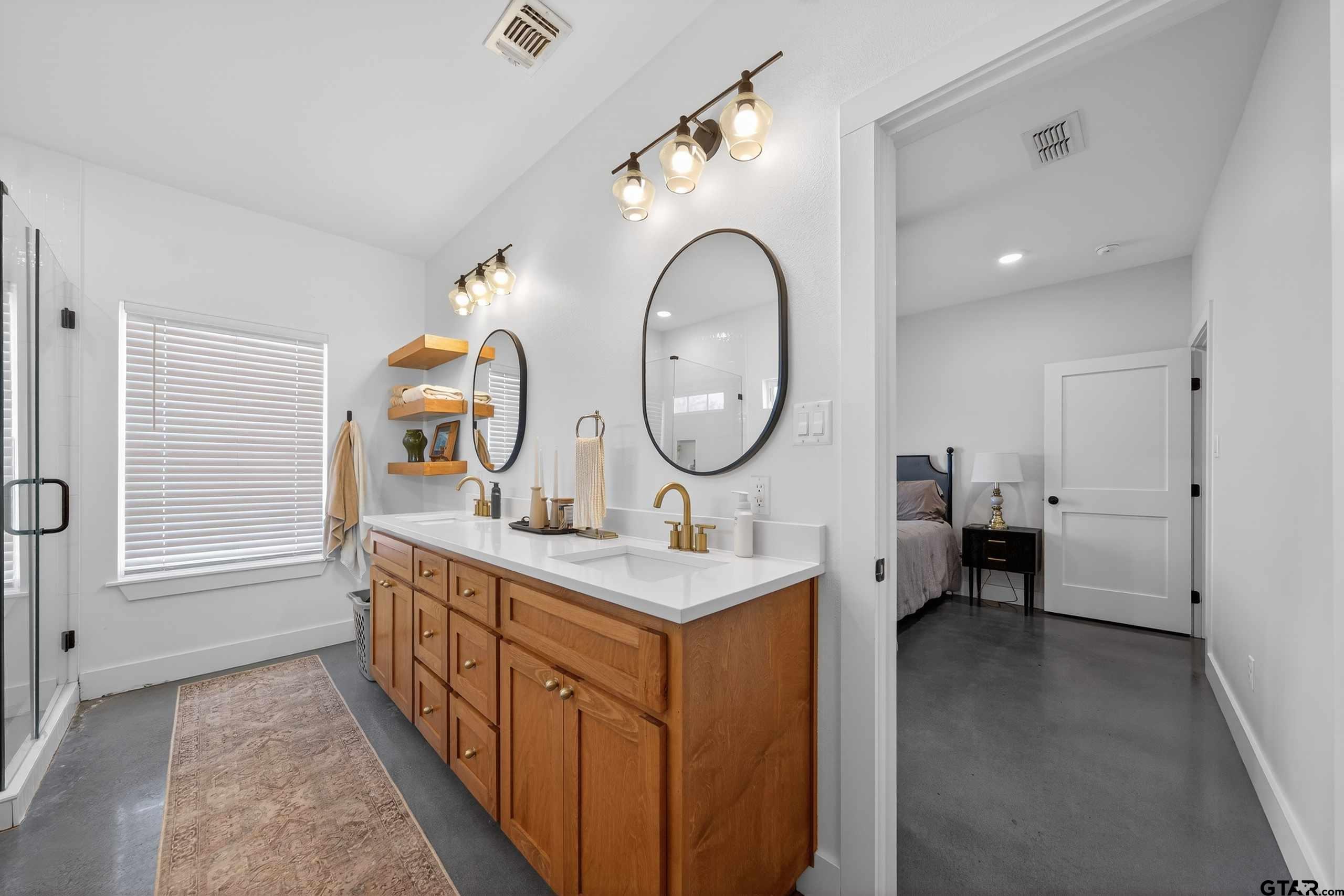 305 Gallatin Cut-Off Road Jacksonville, TX 75766 - Photo 33 of 46 a kitchen with a sink and a mirror