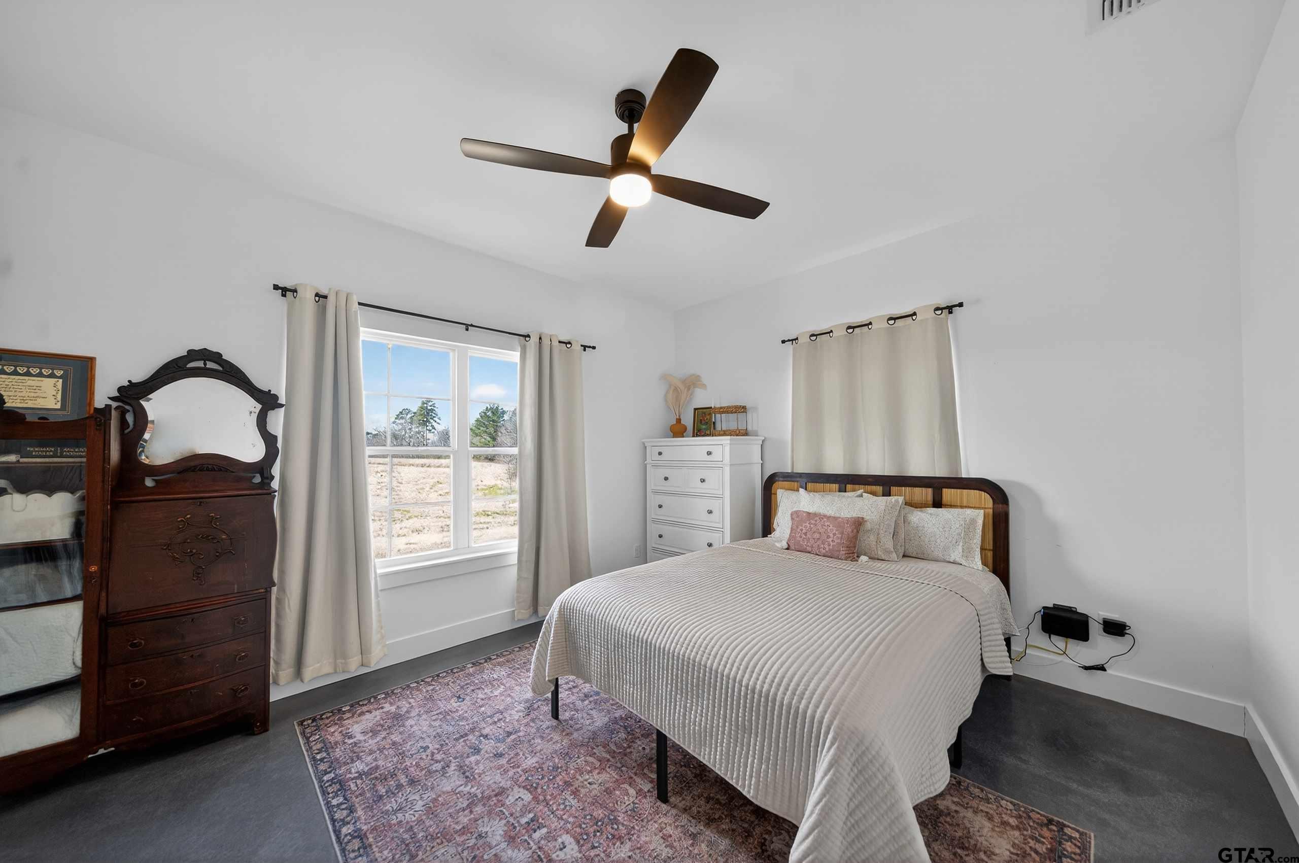 305 Gallatin Cut-Off Road Jacksonville, TX 75766 - Photo 39 of 46 a bedroom with a bed and a window