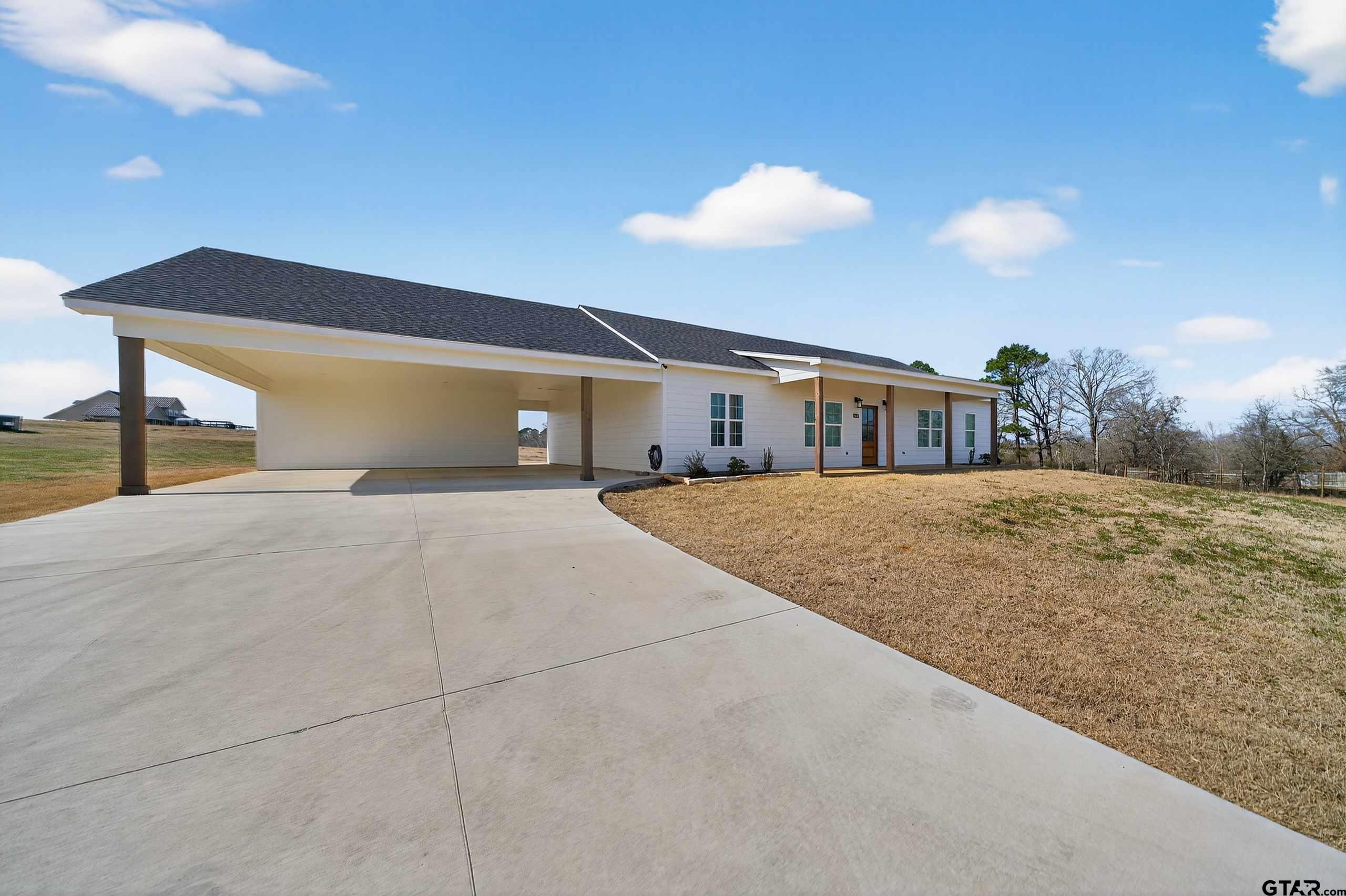 305 Gallatin Cut-Off Road Jacksonville, TX 75766 - Photo 4 of 46 a view of swimming pool with an outdoor space and seating area