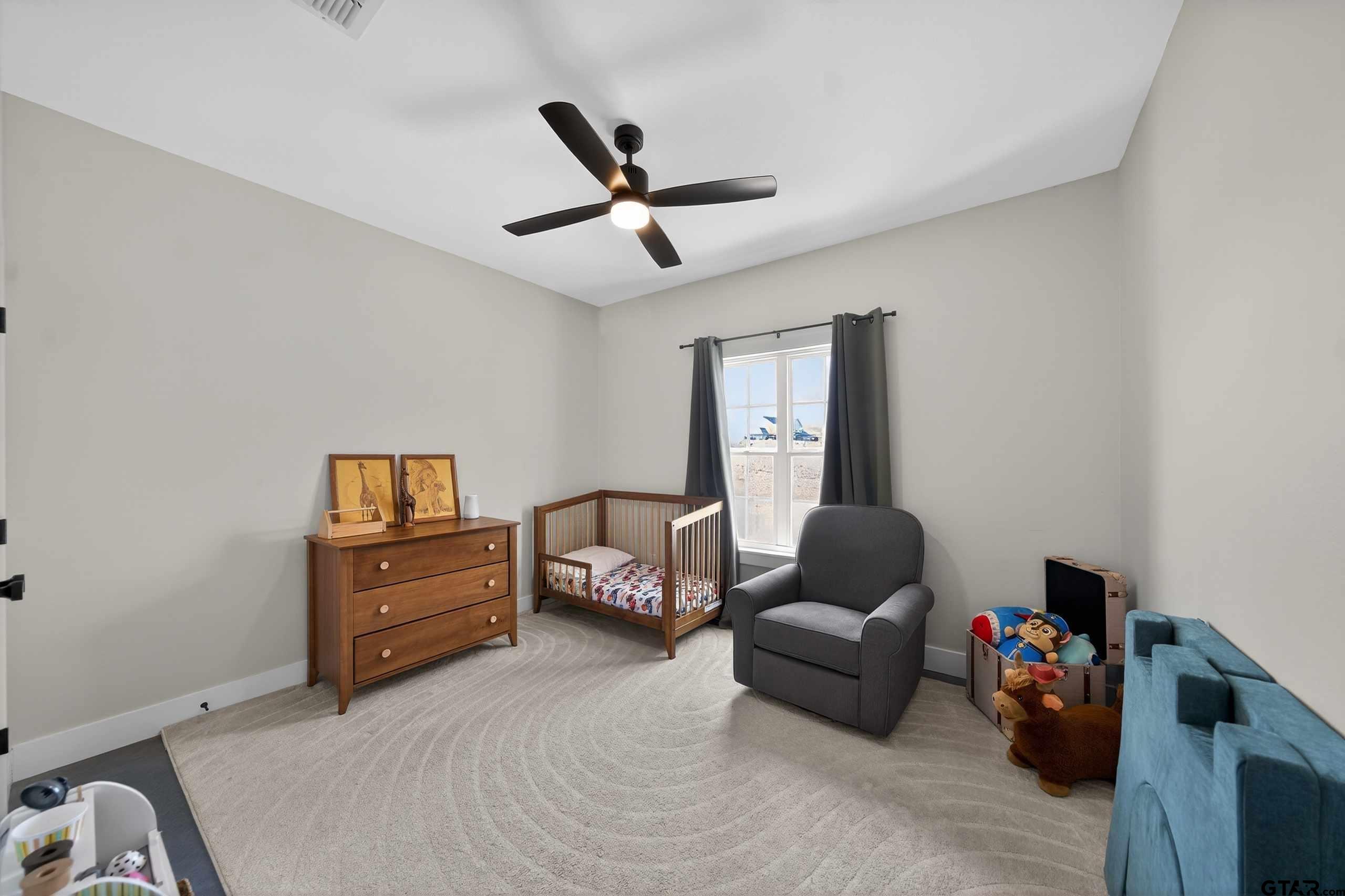 305 Gallatin Cut-Off Road Jacksonville, TX 75766 - Photo 45 of 46 a bedroom with furniture and a window