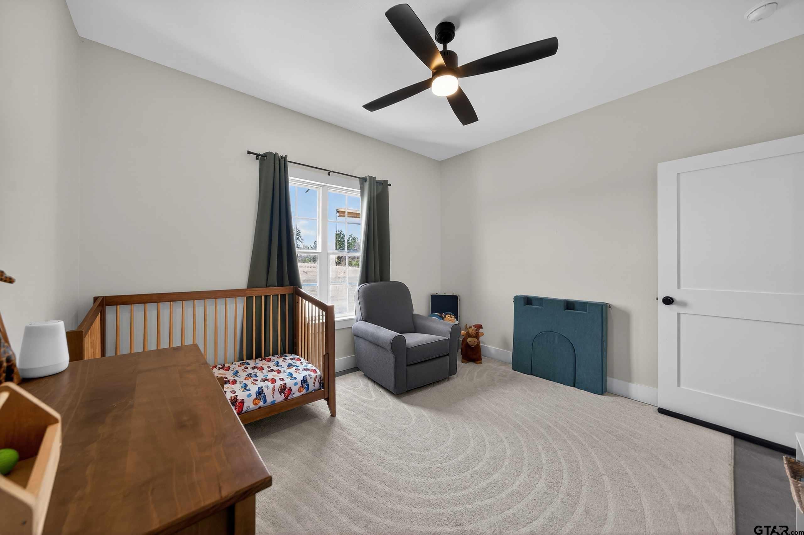 305 Gallatin Cut-Off Road Jacksonville, TX 75766 - Photo 46 of 46 a bedroom with furniture and a window