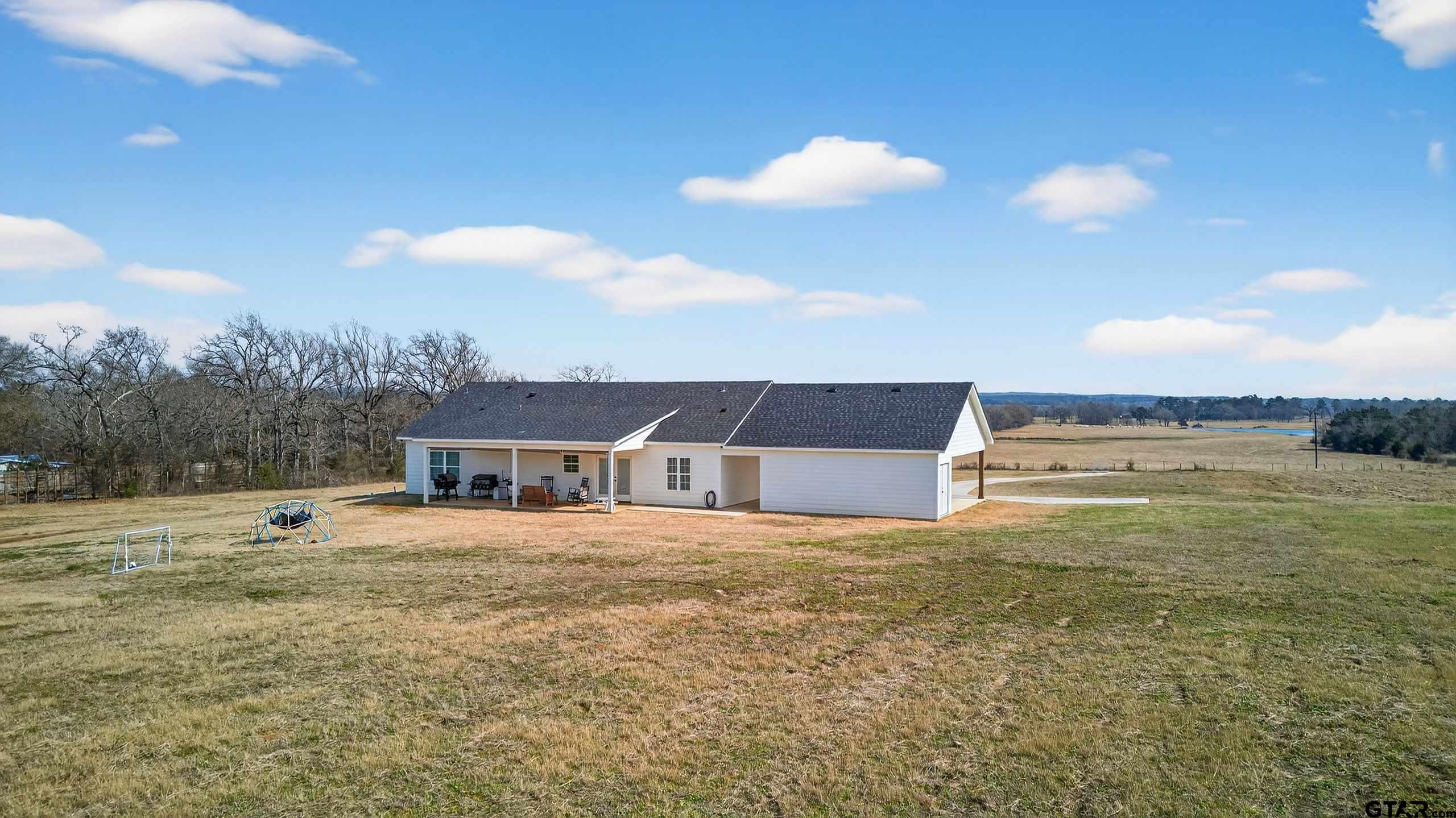 305 Gallatin Cut-Off Road Jacksonville, TX 75766 - Photo 7 of 46 a view of a house with a yard
