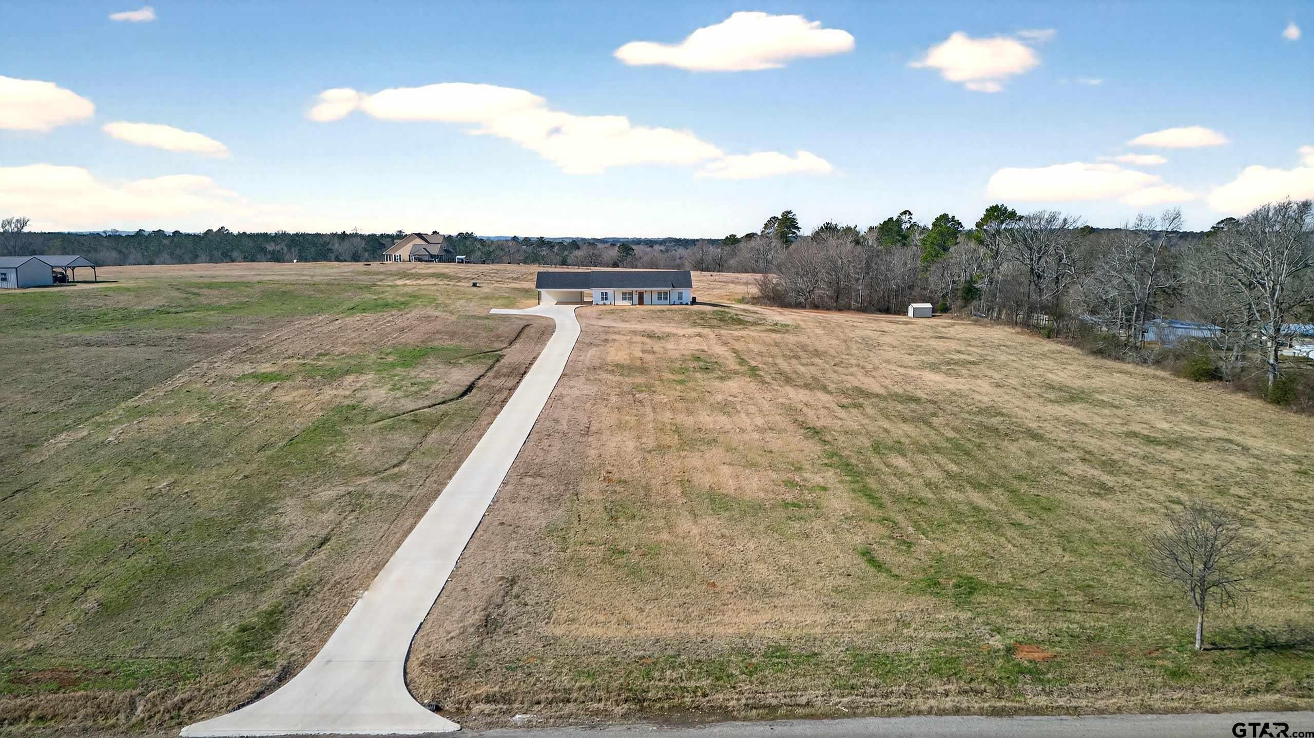 305 Gallatin Cut-Off Road Jacksonville, TX 75766 - Photo 9 of 46 a view of a swimming pool and lake view