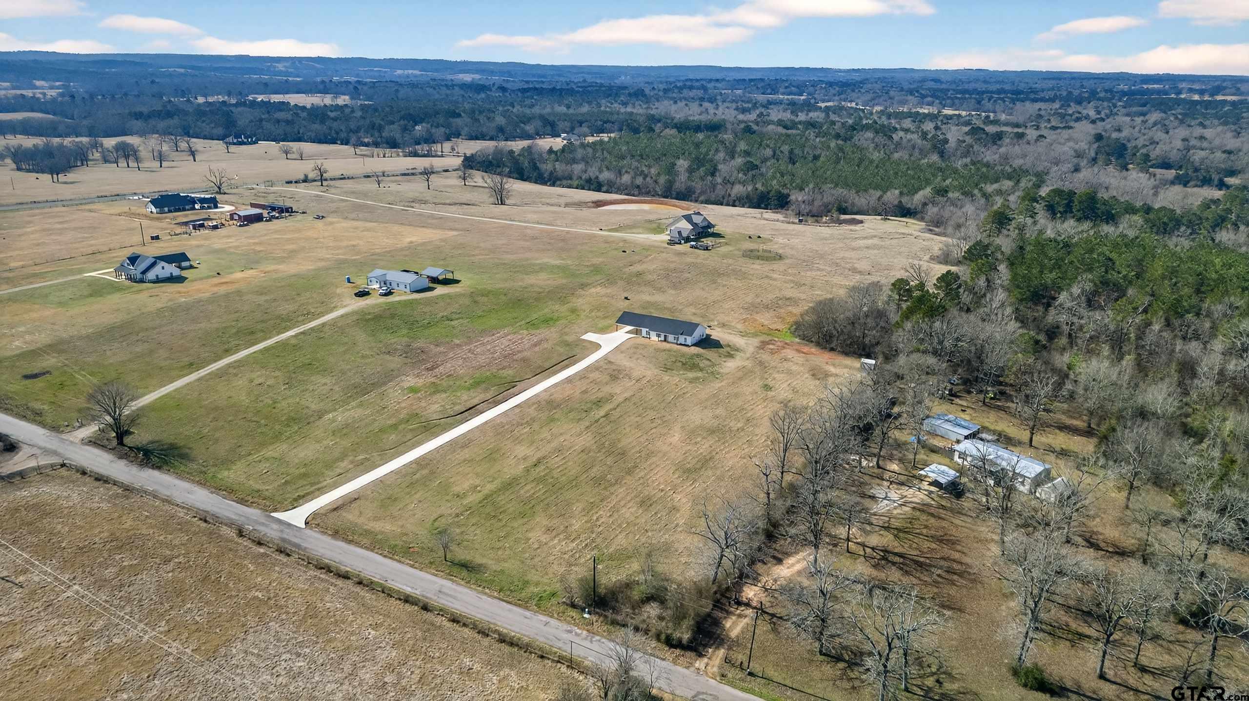 305 Gallatin Cut-Off Road Jacksonville, TX 75766 - Photo 10 of 46 a view of a pool with an outdoor space