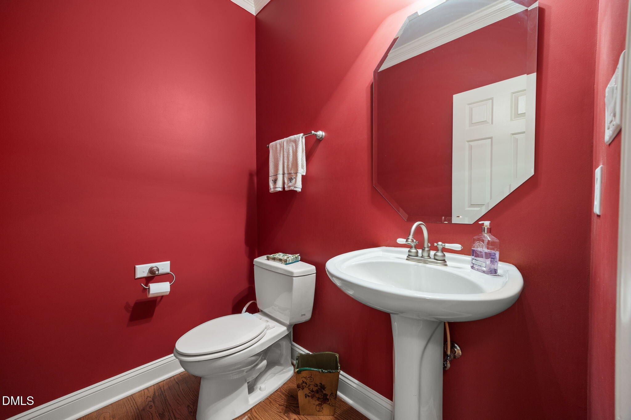 7417 Fontana Ridge Lane Raleigh, NC 27613 - Photo 19 of 54 a bathroom with a sink a mirror and a toilet