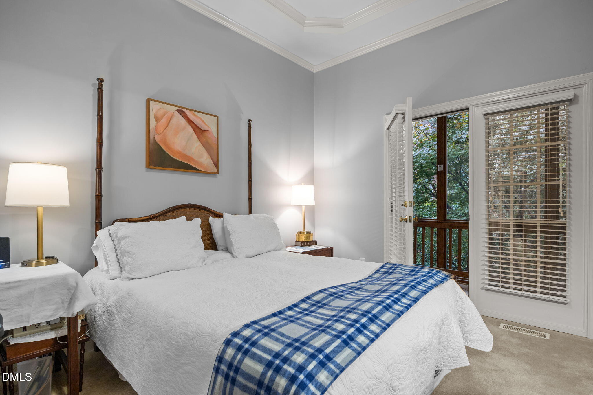 7417 Fontana Ridge Lane Raleigh, NC 27613 - Photo 22 of 54 a bedroom with a bed and a lamp on table next to a window