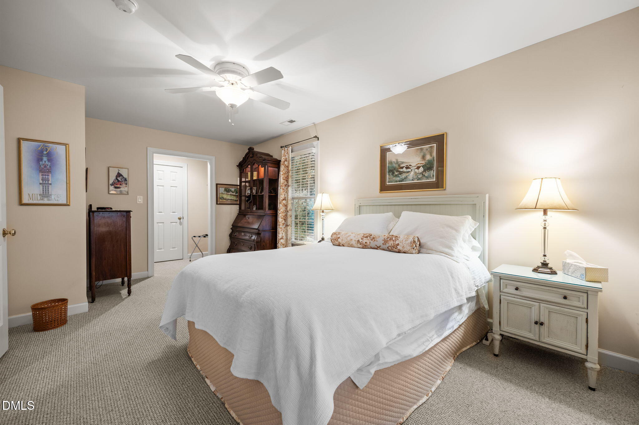7417 Fontana Ridge Lane Raleigh, NC 27613 - Photo 33 of 54 a bedroom with a bed and a chandelier