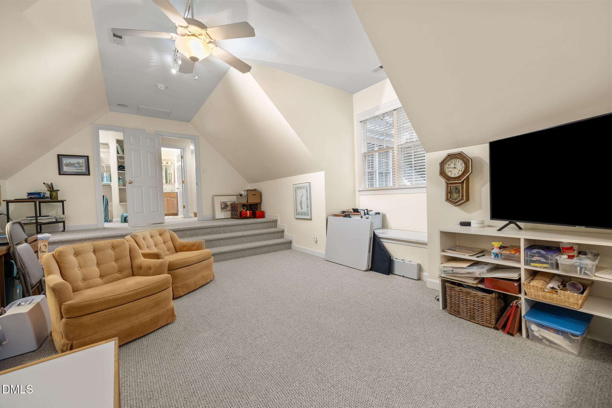 7417 Fontana Ridge Lane Raleigh, NC 27613 - Photo 36 of 54 a living room with furniture and a flat screen tv