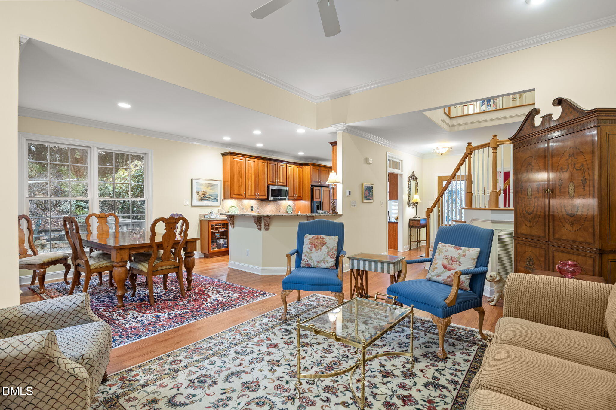7417 Fontana Ridge Lane Raleigh, NC 27613 - Photo 4 of 54 a living room with furniture and a dining table with kitchen view