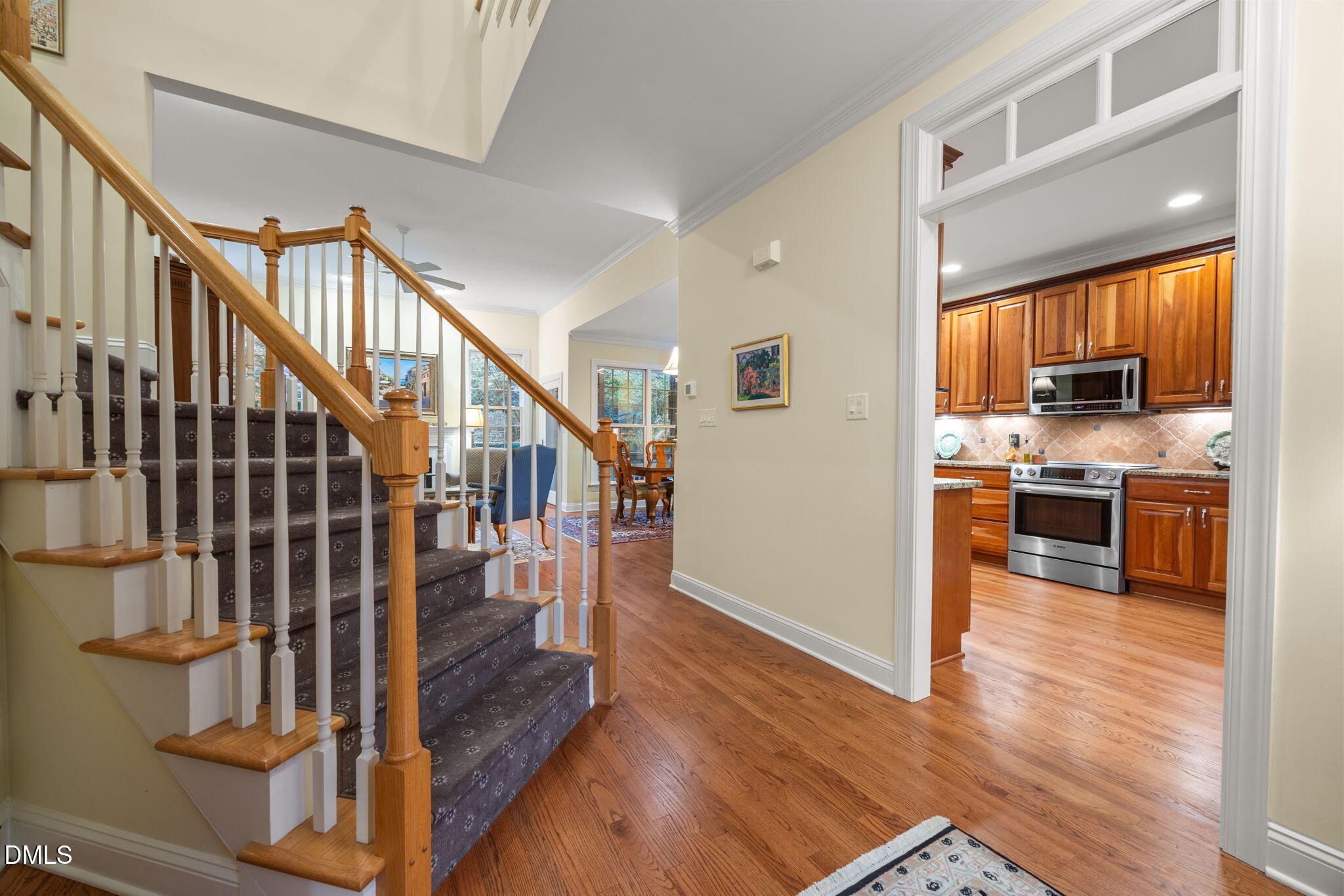 7417 Fontana Ridge Lane Raleigh, NC 27613 - Photo 7 of 54 a view of kitchen with cabinets and wooden floor