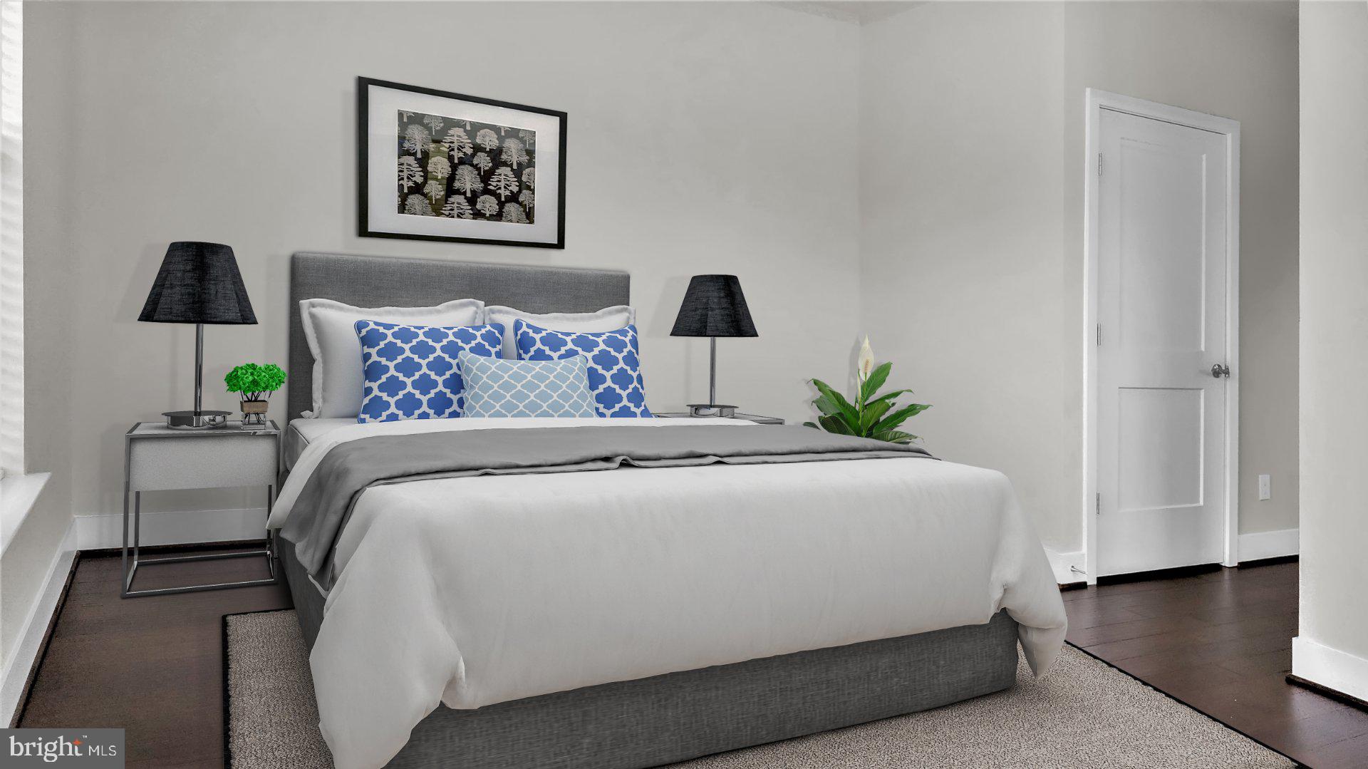 1951 Reston Vly Way, Unit 10 Reston, VA 20191 - Photo 27 of 50 a bedroom with a bed and a lamp