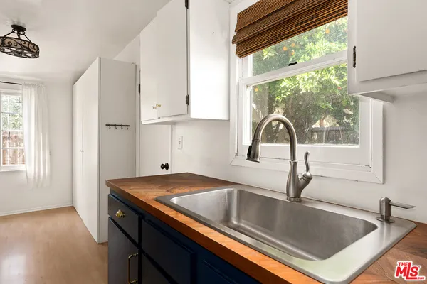 a kitchen with a sink and a window