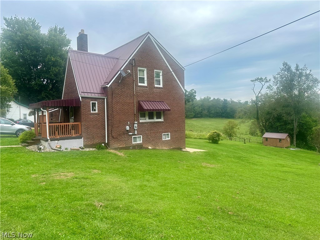 4260 Apple Pie Ridge Road Wellsburg, WV 26070 - Photo 35 of 42 Side of Home featuring a large yard