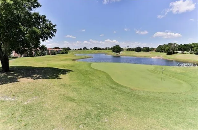 a view of a lake with a big yard