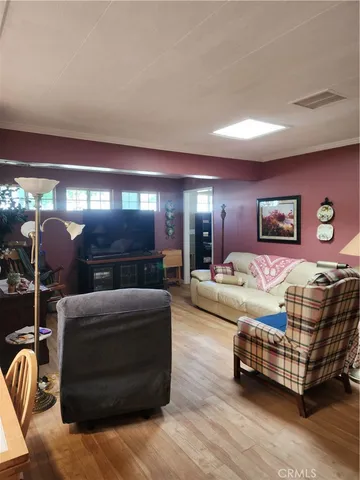 a spacious bedroom with a bed and a couch