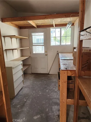 a view of room with window and furniture