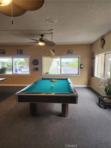 a view of a street with a cars park side of road